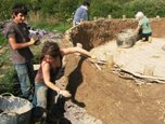 Young volunteers building a celtic roundhouse at the Felin Uchaf Centre, North Wales