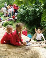 Primary scool children lear about rural crafts and thatching