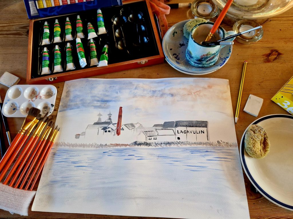 watercolour painting, with paints and brushes beside it.